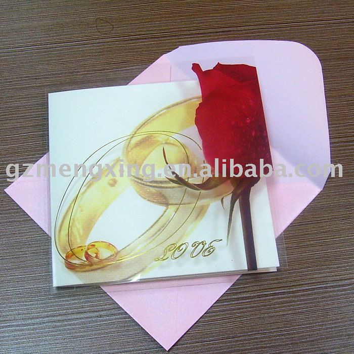 Wedding invitation card with a red rose and wonderful ringsW025