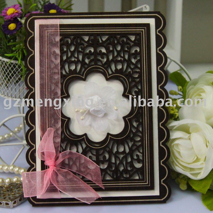 Wooden wedding card with beautiful roses in the middle and fancy patterns 