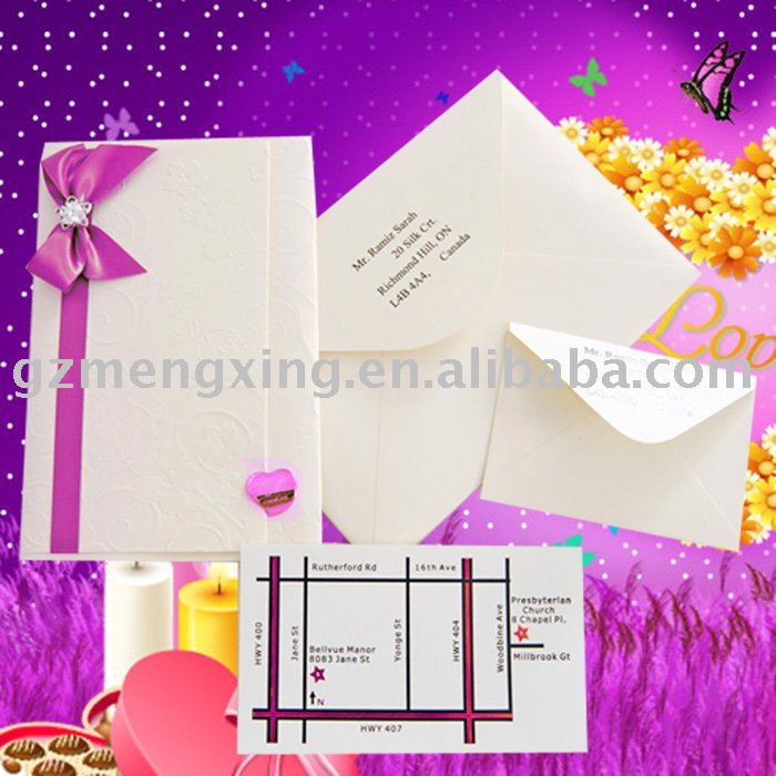 wedding invitation with embossing flowers tied with ribbon bow and nice