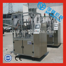 Automatic soft tube filling and sealing machine