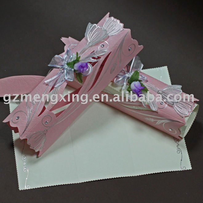 wedding invitation with fancy scroll pattern attaching ribbon bow and 