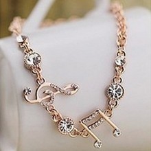Min.order is $10  2013 Fashion Jewelry Gifts Gold Plated Musical Notes Bracelet Rhinestone Charm Bracelet For Women