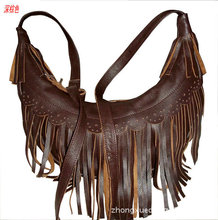 2014 new women’s fashion head layer cowhide tassel backpack free shipping womens real leather shoulder bag
