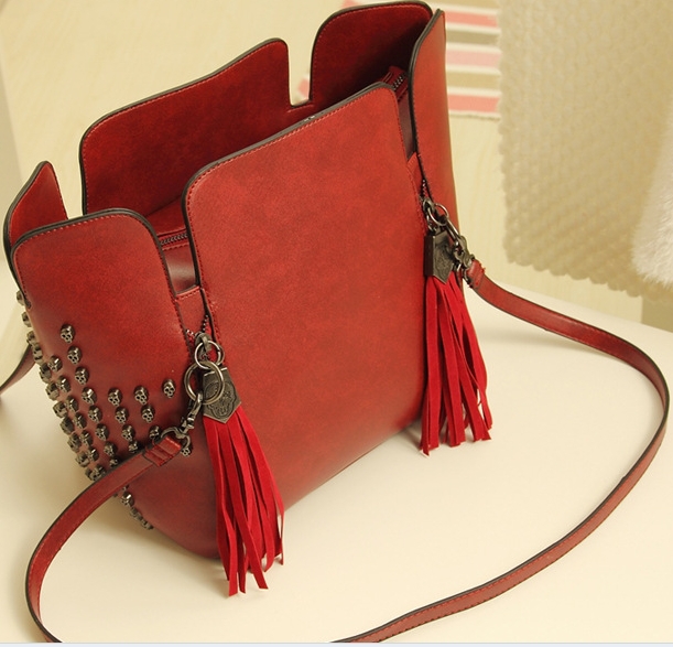 Women bag 2014 version of the new trend of the skull rivets tassel bucket bag retro