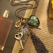 fashion Europe peacock feather leaves big heart keys tassel multi-element vintage long necklace
