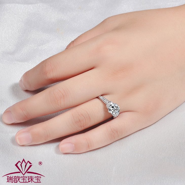 Silver ring on wedding finger